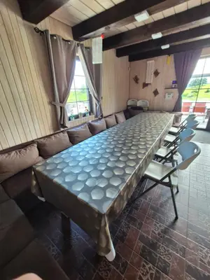 a large conference room with a long table and chairs at Sodyba Pirtis Panarvė in Lazdijai