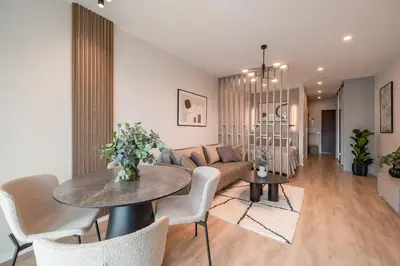 a living room with a couch and a table at Luxury Private Apartment near Old Town and Nature in Vilnius