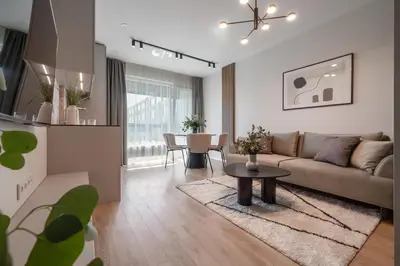 a living room with a couch and a table at Luxury Private Apartment near Old Town and Nature in Vilnius
