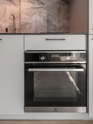 a stainless steel oven in a white kitchen at Luxury Private Apartment near Old Town and Nature in Vilnius