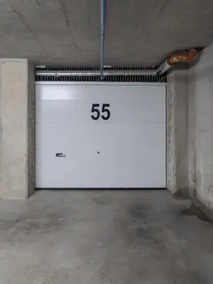 a white garage door with the number on it at Luxury Private Apartment near Old Town and Nature in Vilnius
