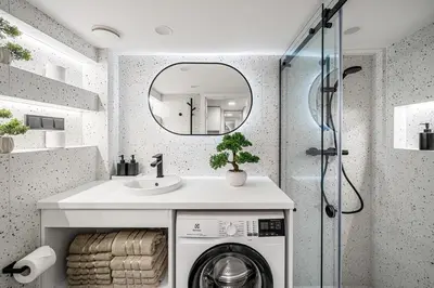 a bathroom with a washing machine and a mirror at Brand New Loft Naujamiestis in Vilnius