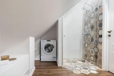 a laundry room with a washer and dryer at ALL SAINTS Residence in Vilnius