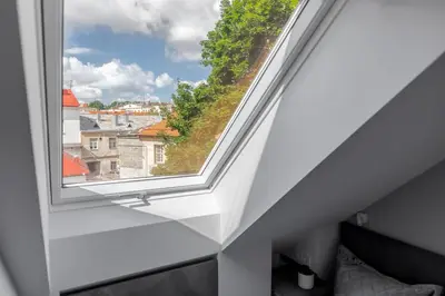 a window in a bedroom with a view at ALL SAINTS Residence in Vilnius