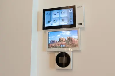 a television on a wall with a picture on it at Cozy home night and day in Kaunas