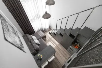 an overhead view of a living room and dining room at Cozy Boho Loft in Vilnius