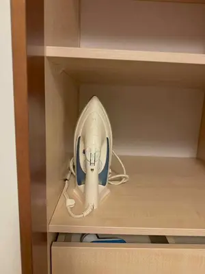 a corded hair dryer in a cabinet drawer at Panorama Apartment Balcony Work Castle View in Vilnius