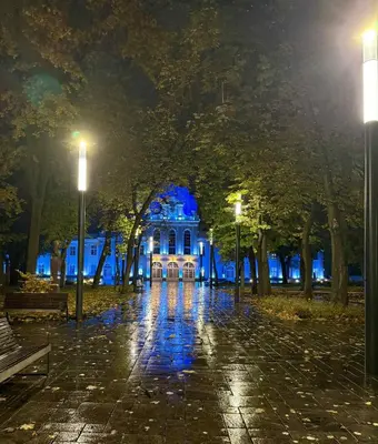 a building with lights in front of it at night at Downtown Kaunas - Maironis 10 in Kaunas