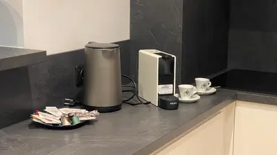 a coffee machine sitting on a counter in a kitchen at Central Kaunas Luxury Apartment with Free Parking in Kaunas