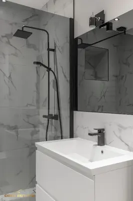 a white bathroom with a sink and a shower at Central Kaunas Luxury Apartment with Free Parking in Kaunas