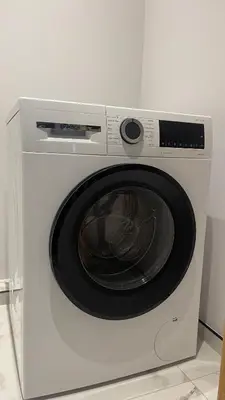 a white washing machine with a bowl inside of it at Central Kaunas Luxury Apartment with Free Parking in Kaunas