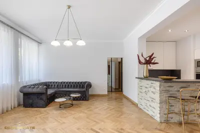 a living room with a couch and a table at Central Kaunas Luxury Apartment with Free Parking in Kaunas