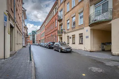 a street with cars parked on the sides of buildings at The Comfort Apartment #1 by Polo Apartments in Kaunas