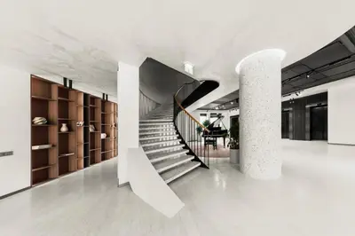 a hallway with a staircase in a building at Pušų nata in Druskininkai