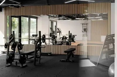 a gym with several rows of treadms and weights at Pušų nata in Druskininkai