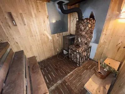 an overhead view of a room with a wood stove at Beloved Family Nest in Vosyliukai