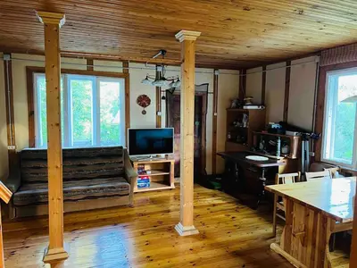 a living room with a couch and a television in a house at Beloved Family Nest in Vosyliukai