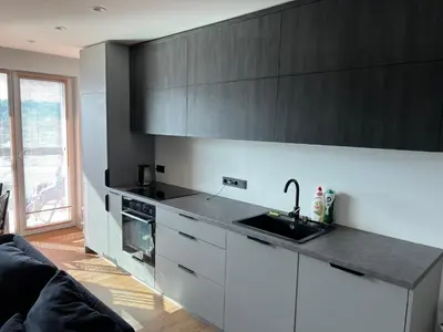 a kitchen with a sink and a counter top at My home Vilnius in Vilnius