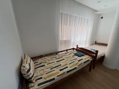 a bedroom with a bed and a window at My home Vilnius in Vilnius