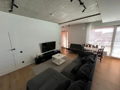 a living room with a couch and a table at My home Vilnius in Vilnius