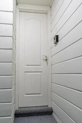 a white door in a room with white walls at STAY Kaunas city center in Kaunas
