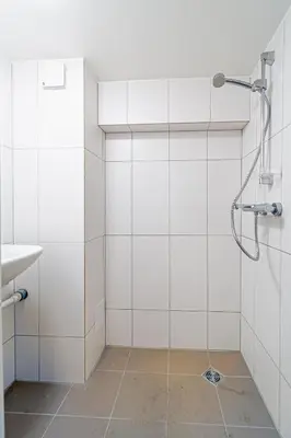 a bathroom with a shower and a sink at STAY Kaunas city center in Kaunas