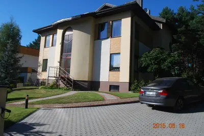 a car parked in front of a house at Ramuma in Vilnius