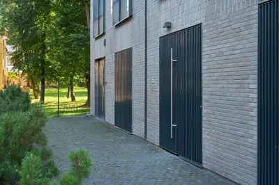 a pair of doors on a brick building at Old Town Pearl Suite in Kaunas