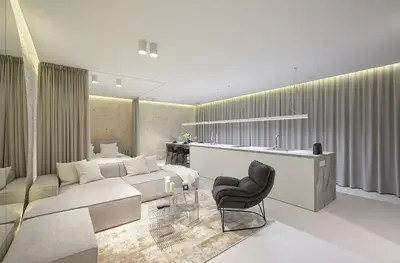 a living room with a couch and a chair at Provokatas in Kaunas