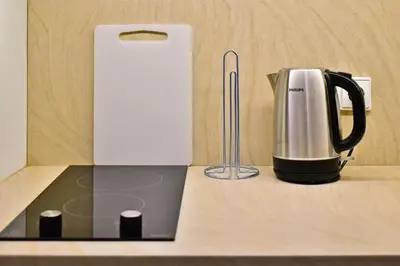 a coffee maker sitting on top of a counter at Domillion 2bdr President Palace free parking L417 in Vilnius