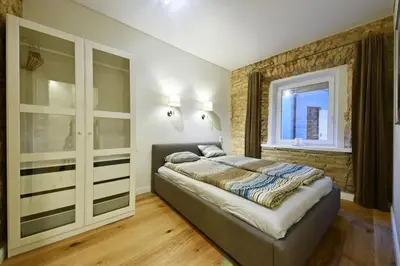 a bedroom with a bed and a window at Domillion 3bdr 2baths President Palace park L419A in Vilnius