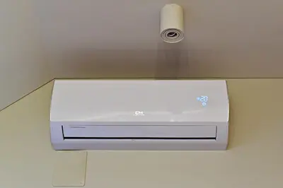 a air conditioner on a wall in a room at Domillion New modern Vilnius old town studio U2302 in Vilnius