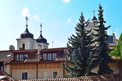 a large building with a christmas tree in front of it at Domillion New modern Vilnius old town studio U2302 in Vilnius