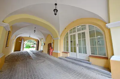 an empty hallway of a building with white and yellow walls at Domillion New modern Vilnius old town studio U2303 in Vilnius