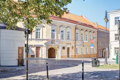 a building with a stop sign in front of it at Domillion New modern Vilnius old town studio U2304 in Vilnius