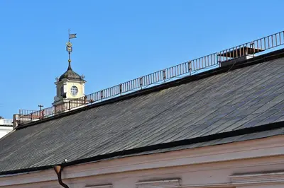 a roof of a building with a clock tower at Domillion 1bdr New old town apt U2305 in Vilnius