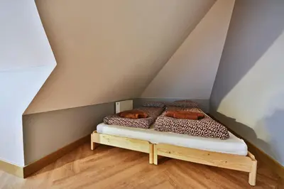 a room with two beds in a attic at Domillion 1bdr New old town apt U2305 in Vilnius