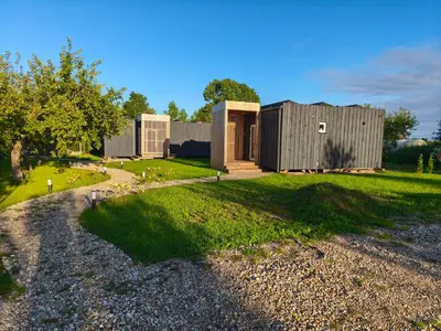 a couple of buildings on a gravel road at Gervių takas 2