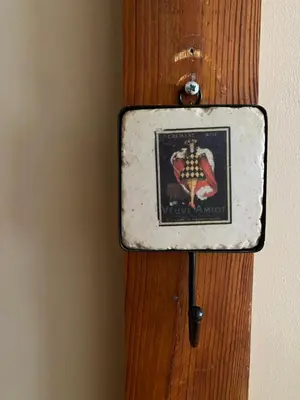 a box on a wooden door with a crest on it at Paupio krantas in Vilnius