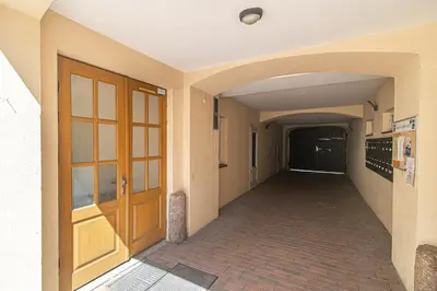 an empty hallway with a door in a building at Spacious 3 BDR apartment in Old Town in Vilnius