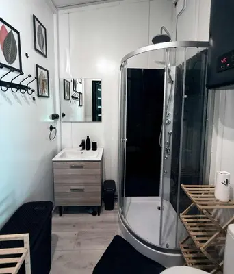 a bathroom with a shower and a sink at Forest Resort House