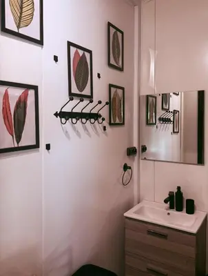 a white bathroom with a sink and a mirror at Forest Resort House