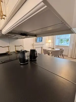a kitchen with a counter with two toasters on it at Luxury Apartment Self Check-In in Vilnius
