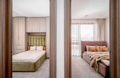a bedroom with a bed and a mirror at sf ghjk in Užliedžiai