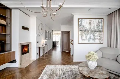 a living room with a couch and a fireplace at sf ghjk in Užliedžiai