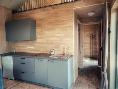 a kitchen with a sink and a counter top at Tytų Vila in Tytuvėnai