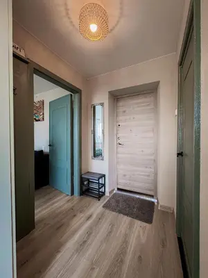 an empty hallway with a closet and a door at Central Park Apartment in Šiauliai