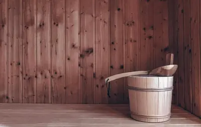 a metal bucket with a wooden spoon in it at Jovarelis in Vilnius