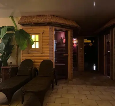 a room with chairs and a building with a door at Jovarelis in Vilnius