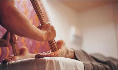 a person laying on a bed looking in a mirror at Jovarelis in Vilnius
